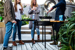 a backyard barbeque with friend socializing
